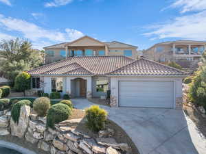 Mediterranean / spanish house with a garage