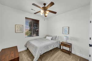 Bedroom featuring carpet and ceiling fan