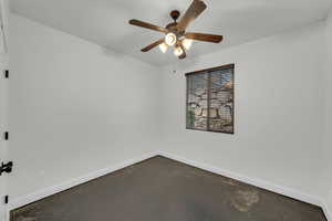 Unfurnished room featuring ceiling fan