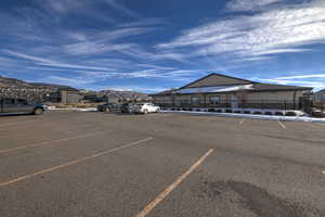 View of vehicle parking featuring a mountain view