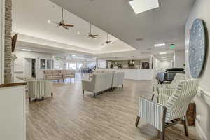 Living room featuring light hardwood / wood-style floors and ceiling fan