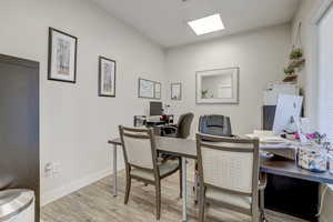 Office area featuring light wood-type flooring