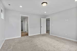 Unfurnished bedroom featuring carpet flooring