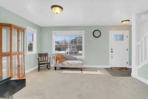 View of carpeted entrance foyer