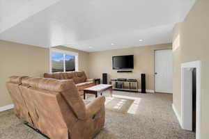 Living room featuring light carpet