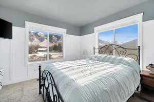 Carpeted bedroom featuring a mountain view