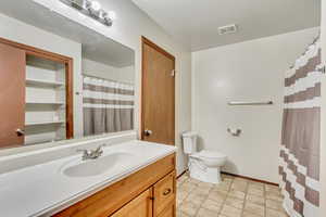 Bathroom with vanity and toilet