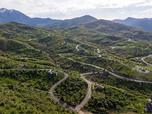 Aerial overview of property's location with a mountainous background