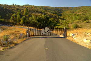 View of gate featuring a mountain view