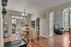 Dining room featuring a chandelier and hardwood / wood-style floors