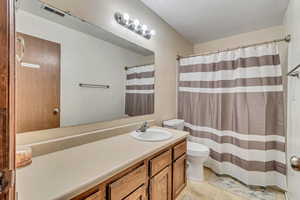 Bathroom with vanity and toilet