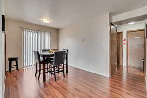 Dining space featuring dark hardwood / wood-style floors