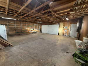 Garage with white refrigerator