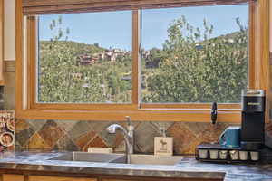 Detailed view of stainless steel counters and decorative backsplash