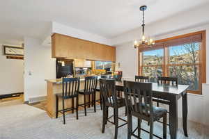 Dining area with an inviting chandelier