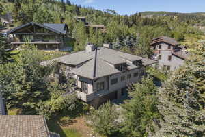 View of subject property with a heavily wooded area