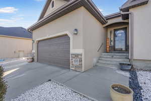 Entrance to property featuring a garage