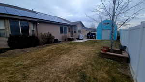 View of yard with a storage shed