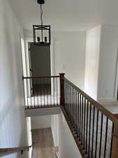 Stairs with hardwood / wood-style flooring