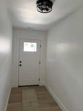 Entryway with light hardwood / wood-style flooring