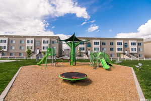 View of playground featuring a yard