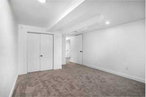 Unfurnished bedroom with a closet and carpet flooring