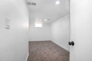 Unfurnished room with carpet