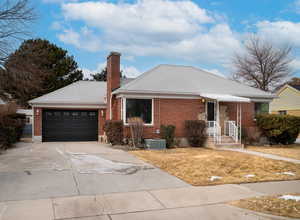 Single story home featuring central AC and a garage