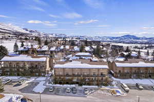 Snowy aerial view featuring a mountain view