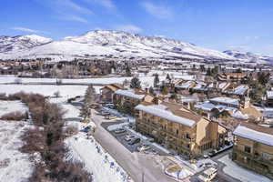 Snowy aerial view with a mountain view