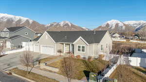 View of front facade featuring a mountain view and a garage