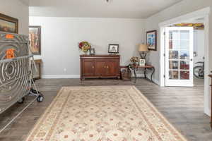 Living area featuring dark hardwood / wood-style flooring