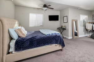 Bedroom featuring carpet and ceiling fan