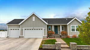 Single story home with fence, a garage, a shingled roof, concrete driveway, and a front yard