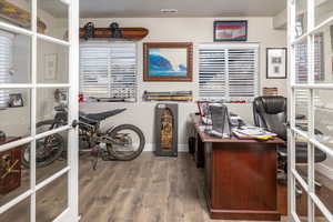 Home office featuring wood-type flooring