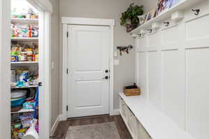 Mudroom with dark hardwood / wood-style floors