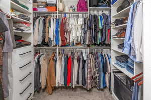 Spacious closet featuring carpet