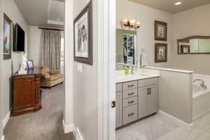 Bathroom with vanity and a bathing tub