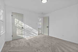 Spare room with light carpet