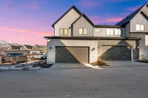 View of front of home featuring a garage