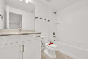 Full bathroom featuring shower / washtub combination, toilet, and vanity