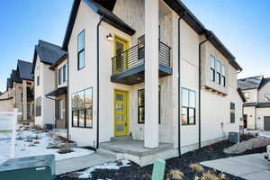 View of snowy exterior featuring central AC unit