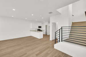 Unfurnished living room featuring light hardwood / wood-style flooring