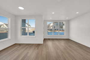 Unfurnished living room featuring light wood-type flooring