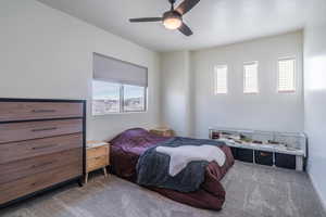 Bedroom featuring carpet and ceiling fan