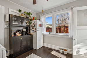 Interior space with dark wood-type flooring and ceiling fan