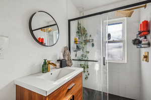 Bathroom with walk in shower and vanity