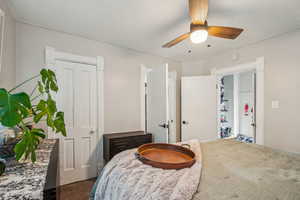 Carpeted bedroom with ceiling fan