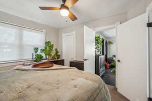 Bedroom with carpet flooring and ceiling fan