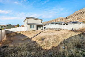 Back of house featuring a mountain view